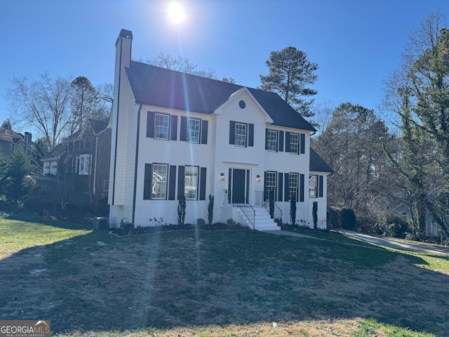 colonial inspired home with a front yard