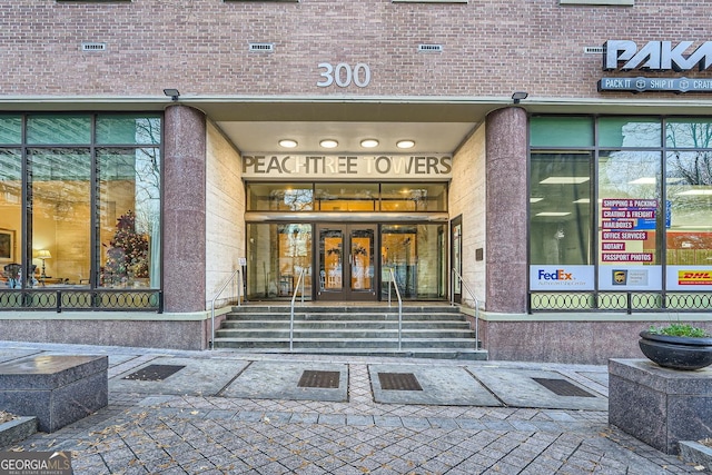 view of exterior entry featuring french doors