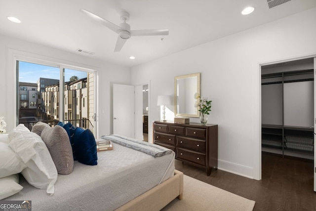 bedroom with a closet, dark hardwood / wood-style flooring, access to exterior, and ceiling fan