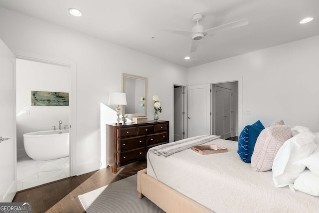 bedroom with dark hardwood / wood-style flooring and ceiling fan