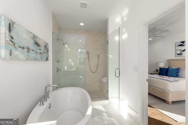 bathroom featuring shower with separate bathtub, ceiling fan, and tile patterned floors