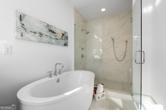 bathroom with separate shower and tub