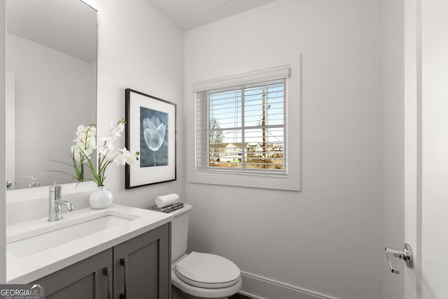 bathroom with toilet and vanity