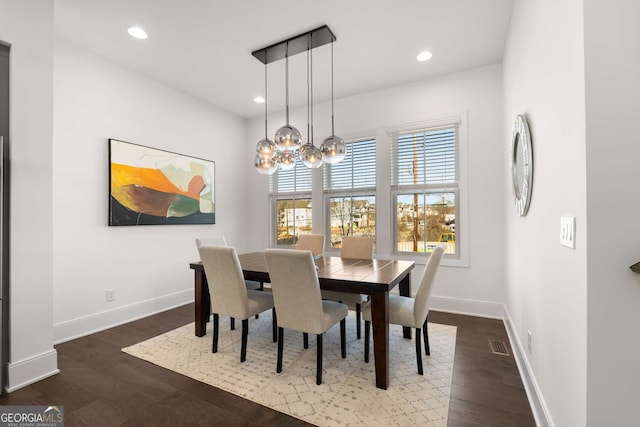 dining room featuring dark hardwood / wood-style flooring