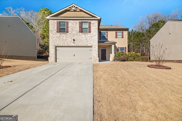 view of front of home featuring a garage and a front yard