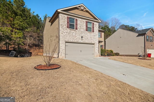 view of front of house featuring a garage and a front yard