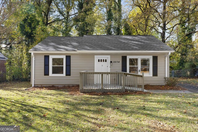 ranch-style home with a front lawn