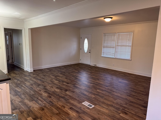 foyer entrance featuring crown molding and dark wood-type flooring