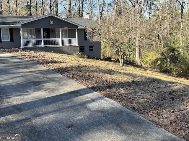 view of property exterior with a porch