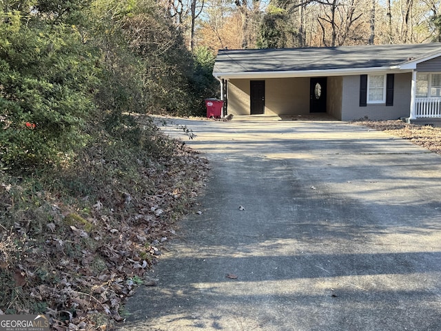 view of side of property featuring a carport