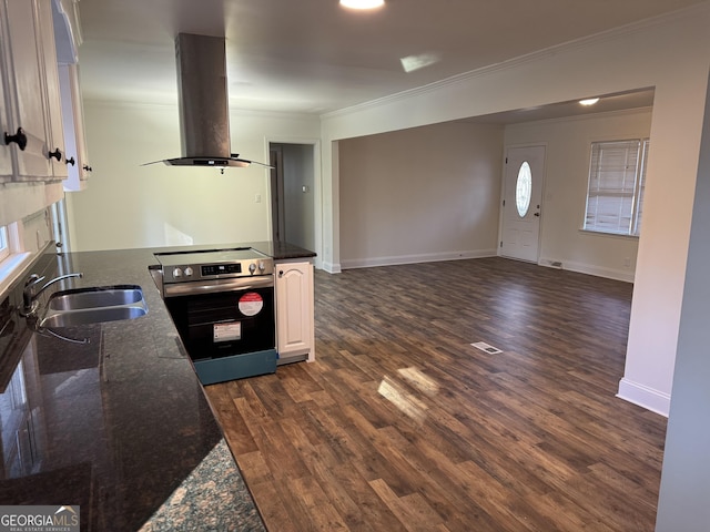 kitchen featuring sink, electric range, dark hardwood / wood-style floors, island range hood, and white cabinetry