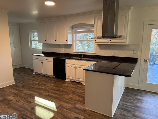 kitchen featuring kitchen peninsula, a wealth of natural light, exhaust hood, dishwasher, and white cabinetry