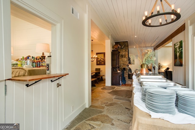 31 Barn Inn Rd, Lakemont, GA 30552 - hallway featuring a chandelier, stone flooring, and wood ceiling