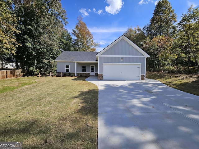 view of front facade with a front yard and a garage