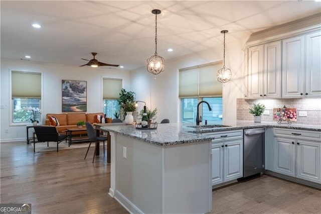 kitchen with white cabinets, decorative light fixtures, and sink