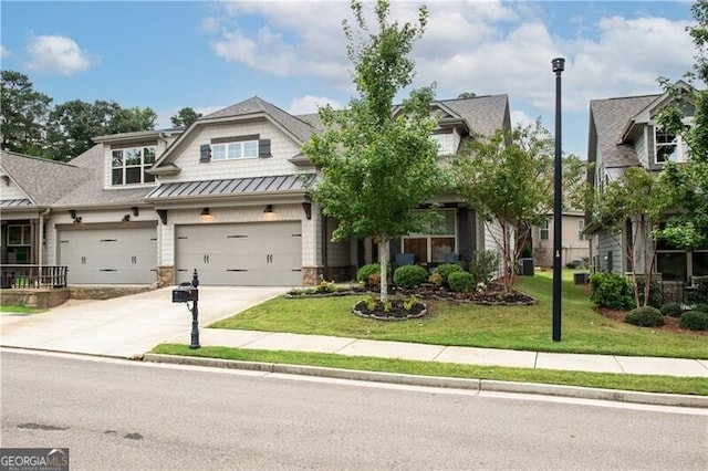 craftsman-style home with a front yard and a garage