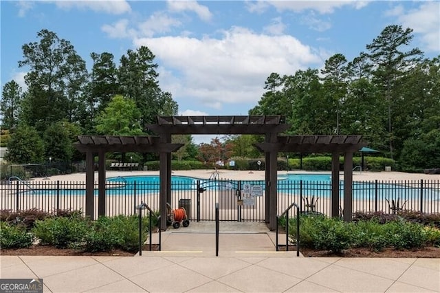 view of pool with a patio area and a pergola