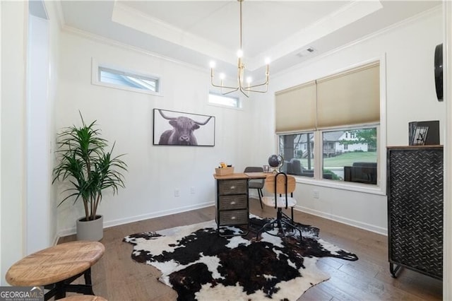 office area featuring a raised ceiling, hardwood / wood-style floors, a healthy amount of sunlight, and an inviting chandelier