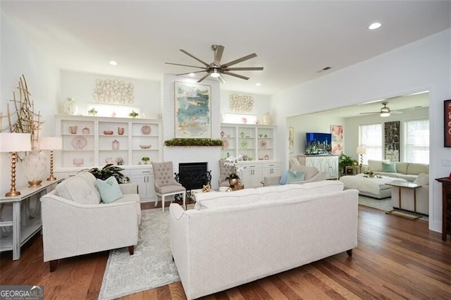 living room with dark hardwood / wood-style flooring