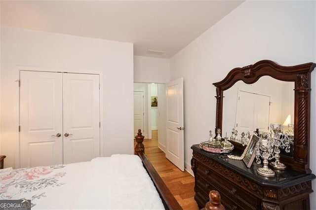 bedroom featuring a closet and light hardwood / wood-style floors