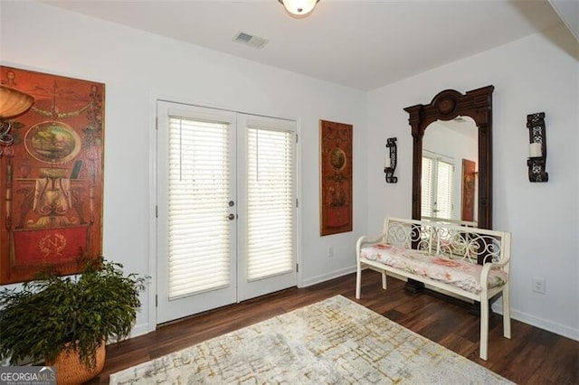 living area with dark hardwood / wood-style floors