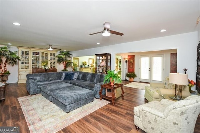 living room with dark hardwood / wood-style flooring and french doors