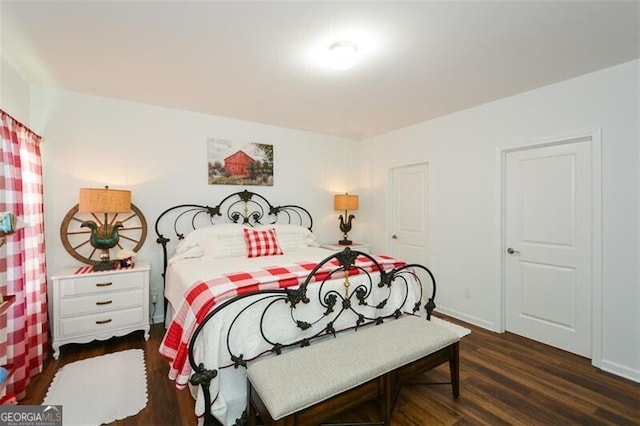 bedroom featuring dark hardwood / wood-style flooring