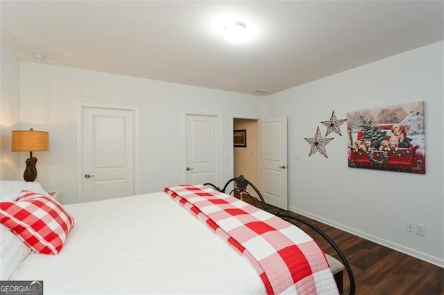 bedroom featuring dark hardwood / wood-style flooring