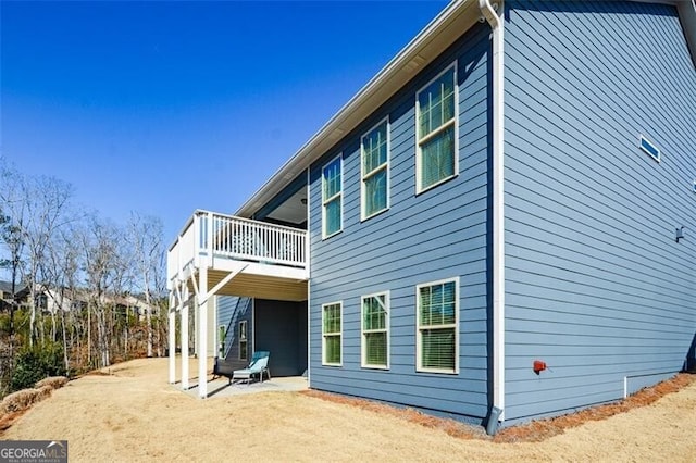 view of side of property featuring a balcony