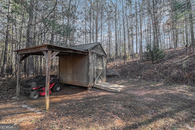 view of outbuilding with a carport