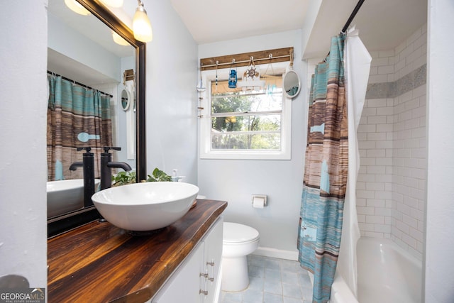 full bathroom featuring vanity, shower / bath combination with curtain, and toilet