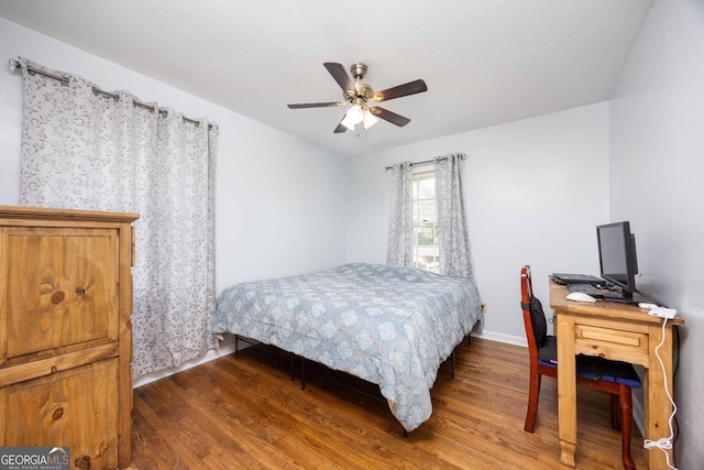 bedroom with ceiling fan and hardwood / wood-style floors