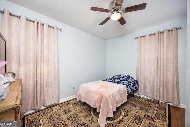 bedroom with hardwood / wood-style flooring and ceiling fan