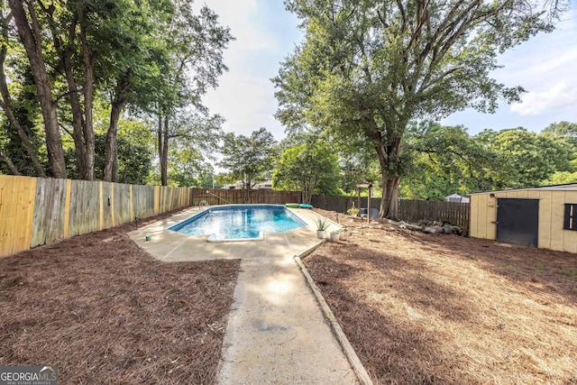 view of swimming pool featuring a storage unit