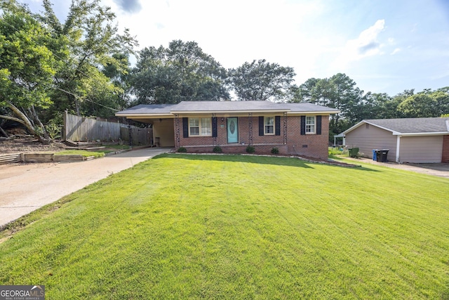 ranch-style home with a carport and a front yard