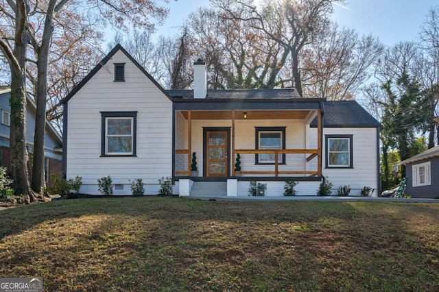 view of front of home with a front lawn and covered porch