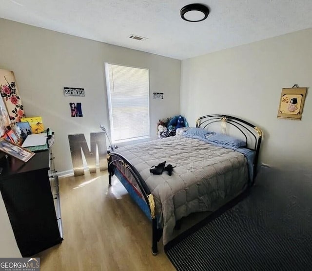 bedroom featuring light hardwood / wood-style flooring