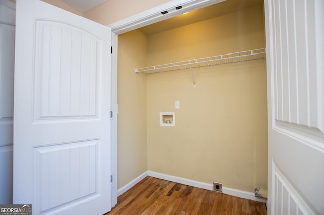 laundry area with washer hookup and dark wood-type flooring