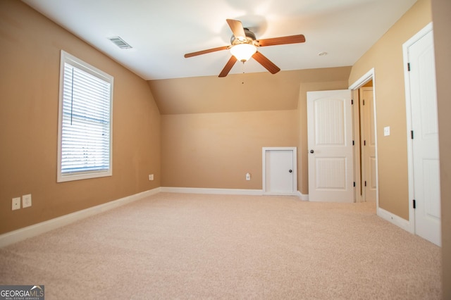 bonus room with carpet, ceiling fan, and lofted ceiling