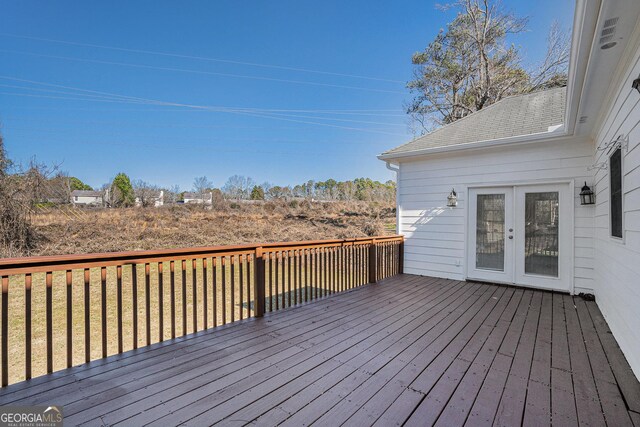 rear view of house featuring a lawn and a sunroom