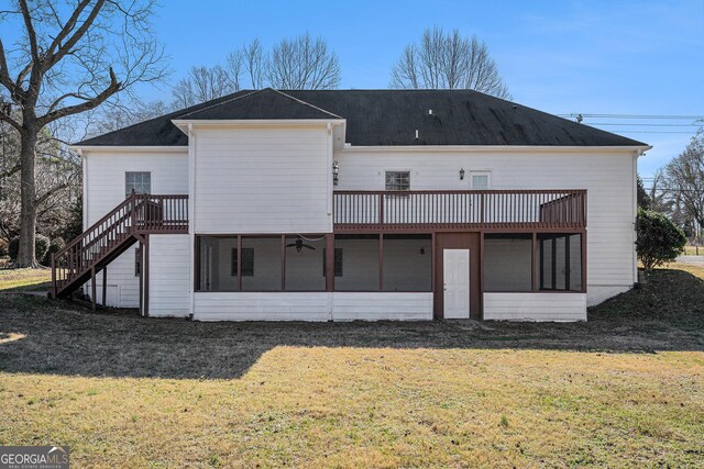 view of side of home featuring a sunroom, a garage, and a yard