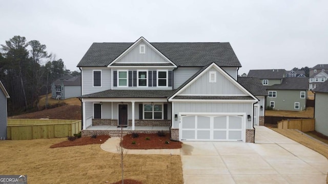 view of front facade with a front lawn, a porch, and a garage