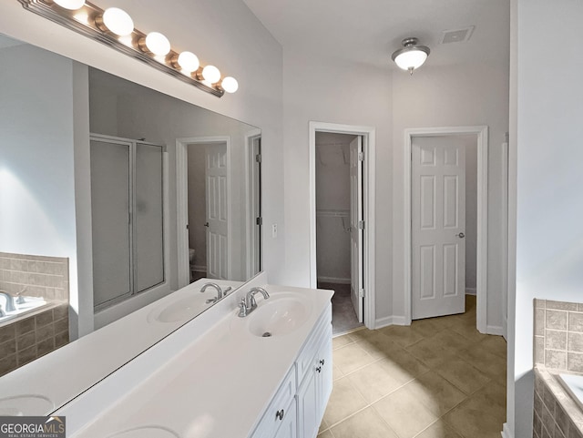 bathroom featuring separate shower and tub, tile patterned flooring, and vanity