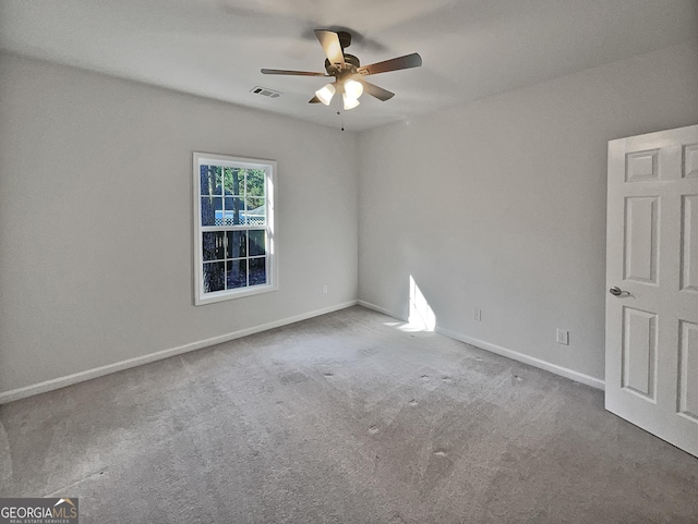 carpeted empty room with ceiling fan