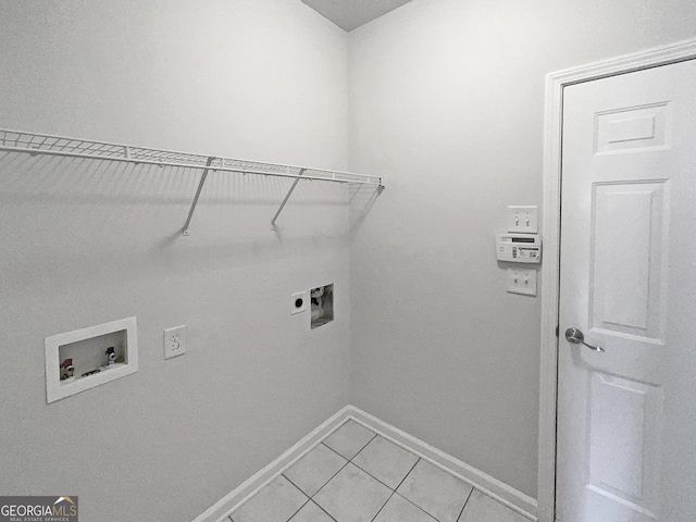 washroom featuring hookup for an electric dryer, hookup for a washing machine, and light tile patterned flooring