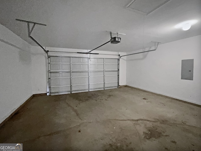 garage featuring electric panel and a garage door opener