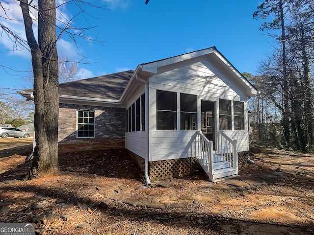 view of front of property with a sunroom