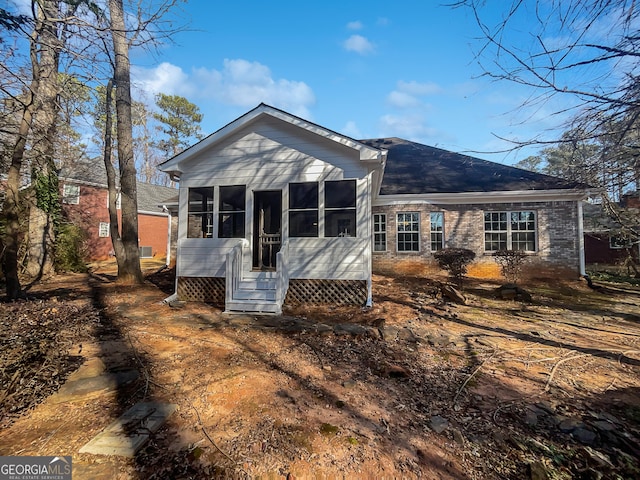 back of house with a sunroom