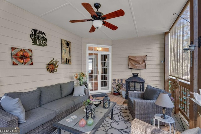 sunroom / solarium with ceiling fan