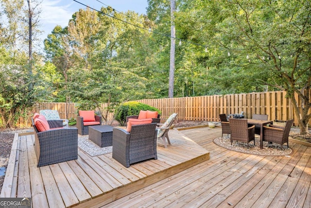 wooden deck featuring an outdoor living space